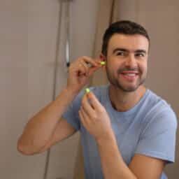 Man protects hearing at home